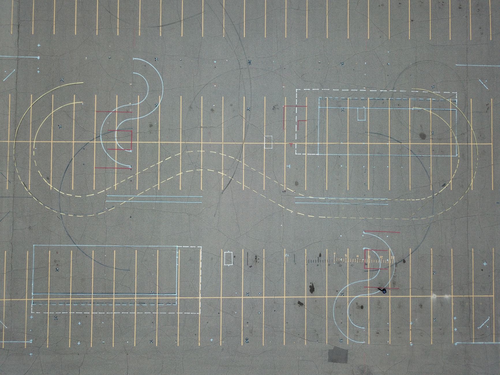 An empty tarmac area marked with road lines, the sort used to practise manoeuvres